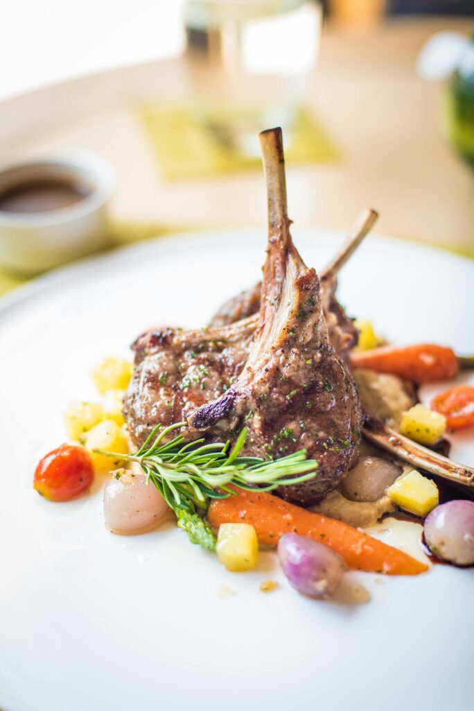 Grilled beef chops served with roasted vegetables and mashed potatoes